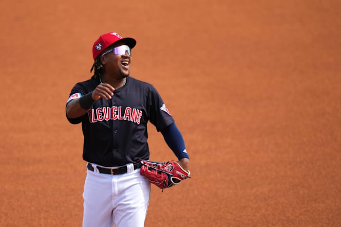 Cleveland Guardians third baseman Jose Ramirez (11) smiles as he takes the field in the first inning during an MLB spring training baseball game against the Cincinnati Reds, Saturday, Feb. 24, 2024, at Goodyear Ballpark in Goodyear, Ariz.